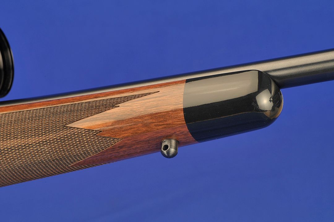 Stan’s favorite style of a classic gun is shown here in part as he likes a black forend tip cut at a 90-degree angle to go along with a crisp point pattern checkering design with some extras added in.